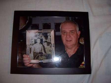 son Andrew Magyar holding fathers pic on LST 325