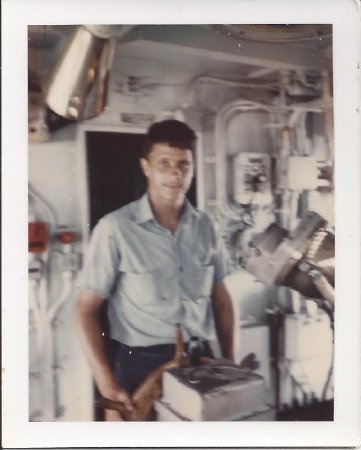 Unknown Sailor at Helm of USS Sutton County (LST-1150)