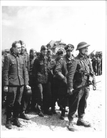 British Soldier Escorting German POWs