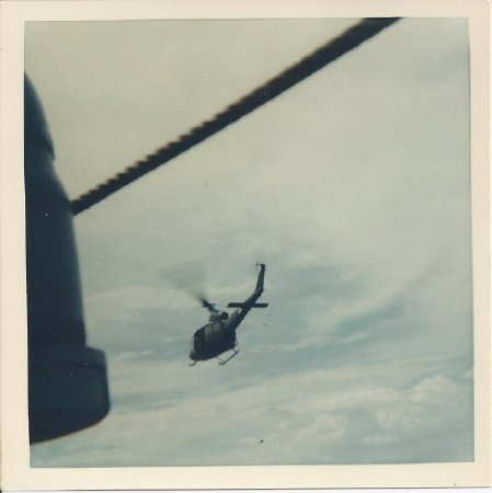 UH-1 Huey over USS Sutton County (LST-1150)