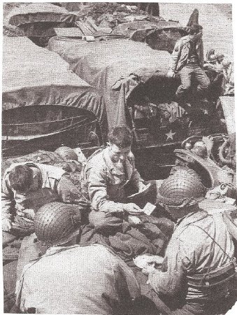 Trucks & troops playing cards on LST-317